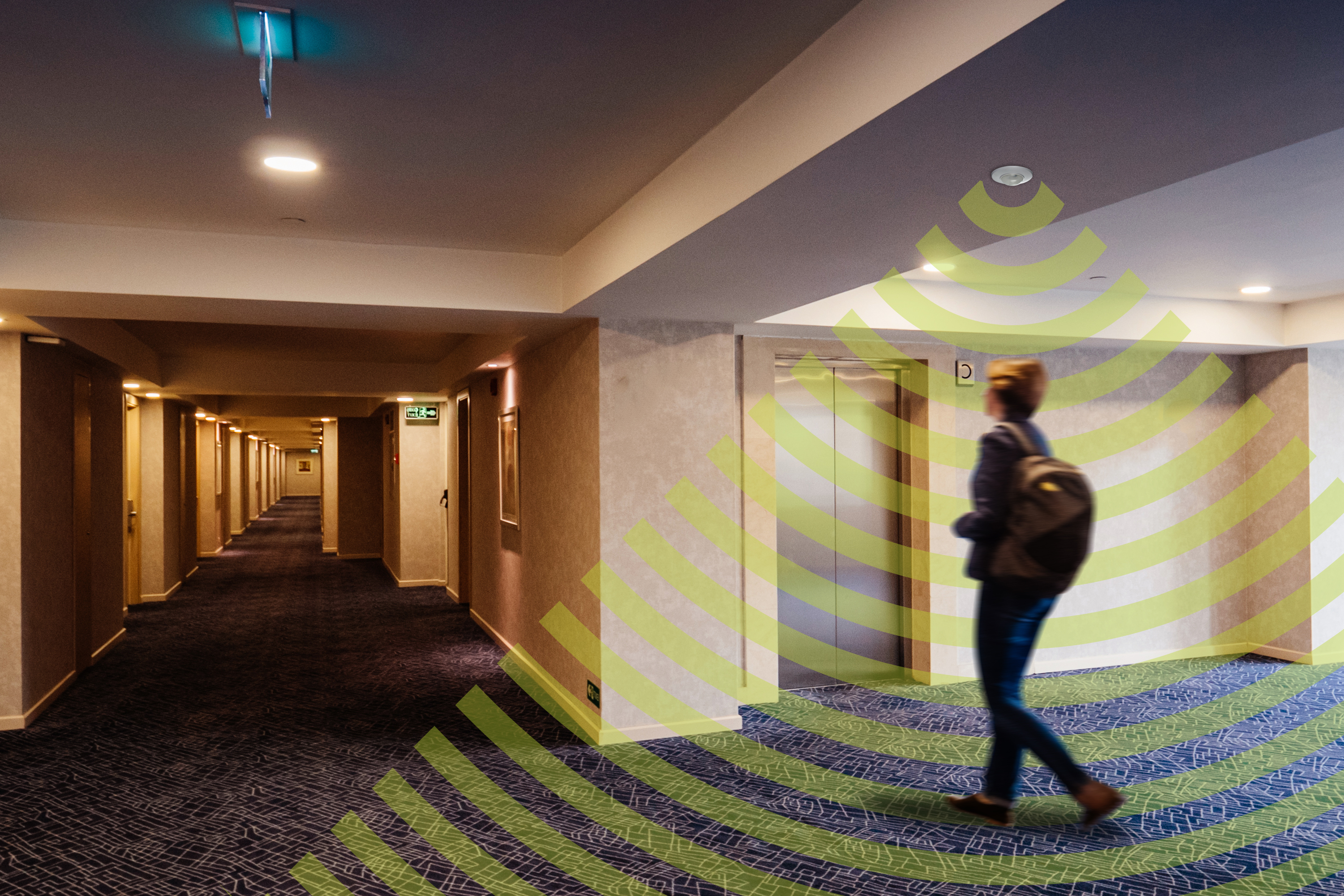 Woman walking in corridor with illustration of microwaves over the top