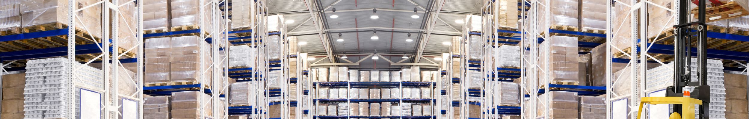 Warehouse with circular high bay luminaires