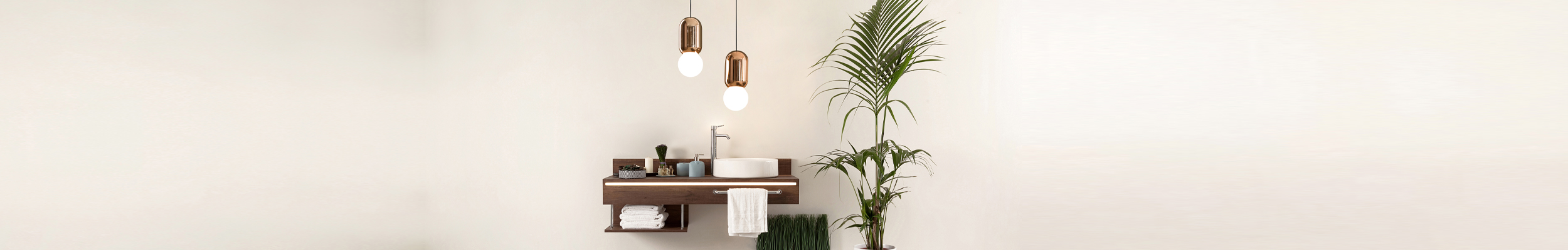 Minimalist bathroom sink / vanity unit with strip lighting on the front, lifestyle accessories and distinctive pendants